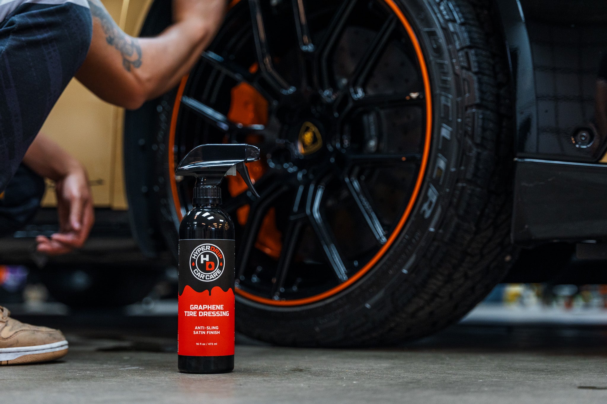 Load video: Video of a detailer applying HyperDrip Graphene Tire Dressing onto a car tire, showing the satin finish effect.